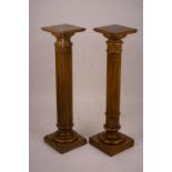 A pair of Victorian style carved beech and walnut pedestals, height 110cm