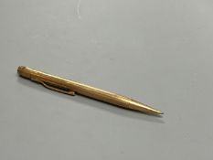 An engine turned 9ct gold propelling pencil