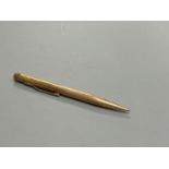 An engine turned 9ct gold propelling pencil