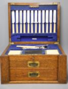 An Edwardian oak cased canteen of plated Kings pattern cutlery