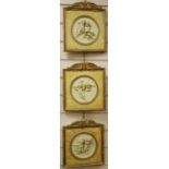 A set of three gilt framed composition plaques27x23cm