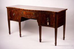 A George III style mahogany serpentine sideboard on square tapered legs, width 184cm, depth 63cm,