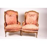 A pair of early 20th century French carved beech armchairs, width 75cm, depth 78cm, height 110cm
