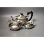 A late Victorian demi-fluted three piece tea set, Nathan & Hayes, Chester, 1896,gross weight 22.