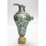 An ormolu mounted green fossil marble ewer, (a.f.)29cm