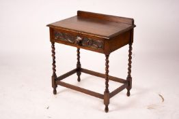An early 20th century Flemish carved oak side table, W.69cm D.46cm H.77cm