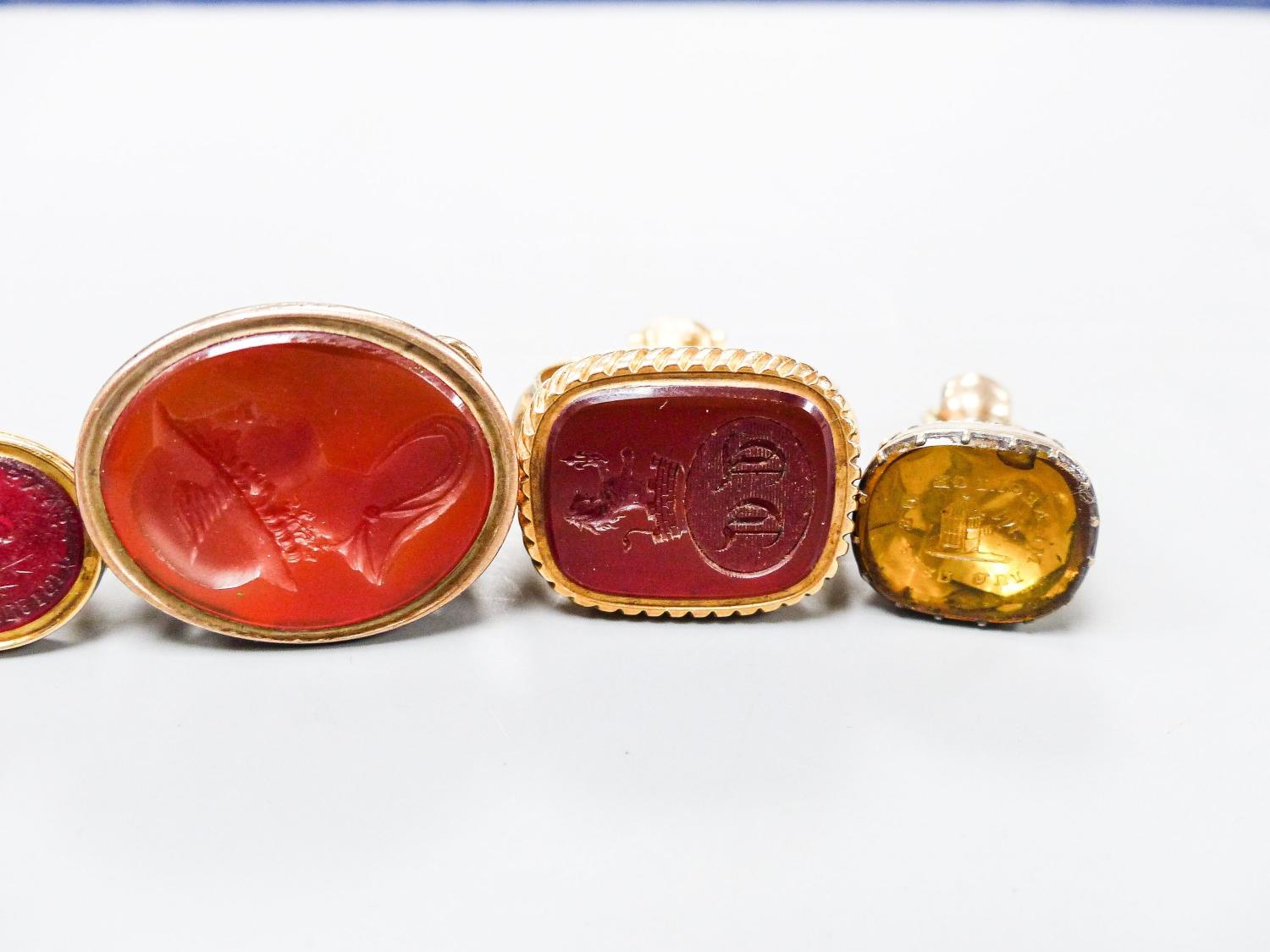 A collection of six 19th century and late assorted yellow metal overlaid and chalcedony set fob seal - Image 4 of 4