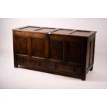 An 18th century panelled oak mule chest, length 161cm, depth 61cm, height 84cm