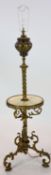 A late Victorian cast brass lamp standard, the column with an alabaster mid tier, raised on an