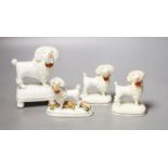 Four Staffordshire porcelain figures of poodles holding a basket of flowers, c.1830-50, one modelled