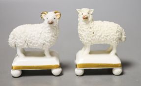 A pair of Staffordshire porcelain models of a ram and a ewe, c.1830–50, each standing on a