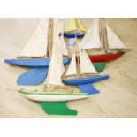 A group of five painted wood pond yachts