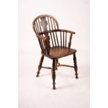 A mid 19th century yew and elm Windsor elbow chair with crinoline stretcher, width 54cm, depth 46cm,