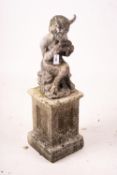 A cast lead figure, seated pan, on reconstituted concrete base, total height 107cm