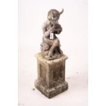 A cast lead figure, seated pan, on reconstituted concrete base, total height 107cm