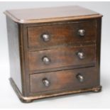 A Victorian miniature mahogany chest of 3 drawersMinor scuffing,27cm
