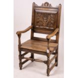 An early 20th century carved oak wainscot chair