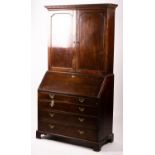 A George III oak bureau cabinet, width 108cm, depth 52cm, height 209cm