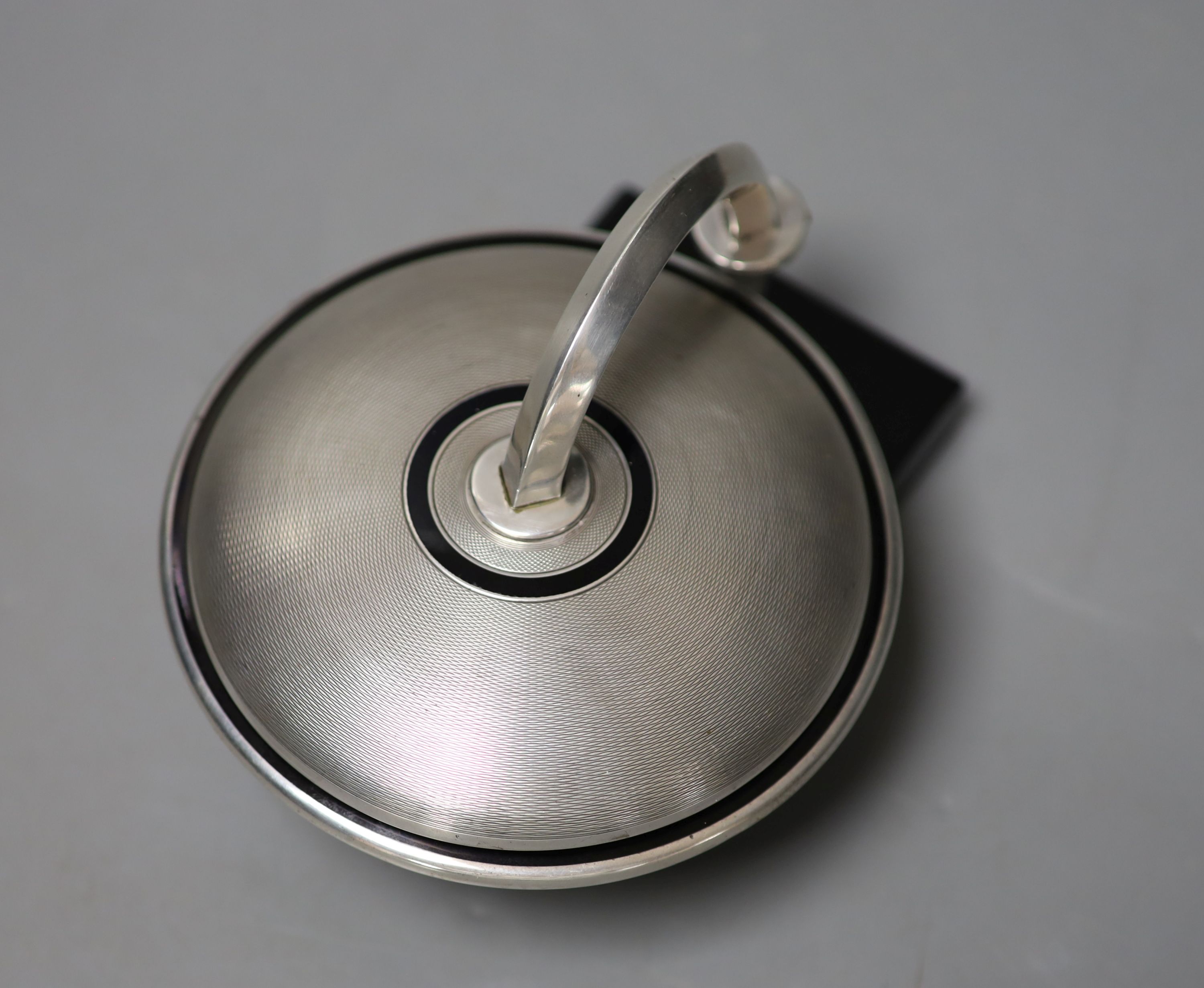 An unusual Art Deco engine turned silver and black enamel circular compact, with support arm, on - Image 2 of 4