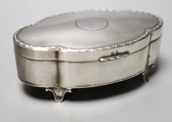 A George V part engine turned silver mounted shaped oval trinket box, Birmingham, 1911, 13.2cm.