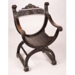An ebonised Sagrada style elbow chair