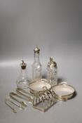 A pair of modern silver mounted glass butter dishes, a silver toastrack, three silver mounted