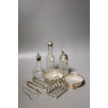 A pair of modern silver mounted glass butter dishes, a silver toastrack, three silver mounted