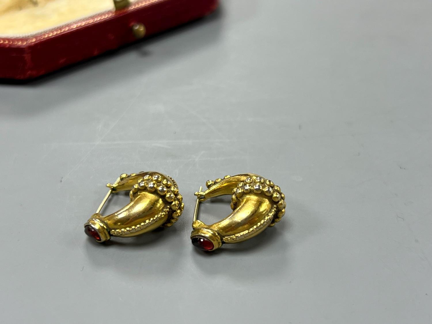 A modern pair of gilt metal earrings, together with a Cartier gilt tooled red leather jewellery - Image 2 of 4