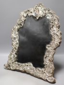 An Edwardian repousse silver mounted easel mirror, with foliate scroll decoration, Chester, 1902,