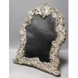 An Edwardian repousse silver mounted easel mirror, with foliate scroll decoration, Chester, 1902,