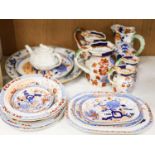 Nine pieces of Victorian Masons Ironstone, five Hydra jugs, a Delft charger and relief moulded