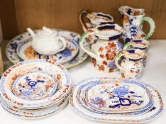 Nine pieces of Victorian Masons Ironstone, five Hydra jugs, a Delft charger and relief moulded