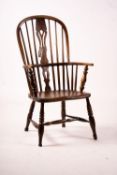 An early 19th century ash, elm and fruitwood Derbyshire area Windsor armchair with 'H' stretcher,