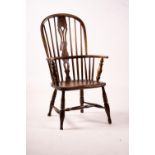 An early 19th century ash, elm and fruitwood Derbyshire area Windsor armchair with 'H' stretcher,