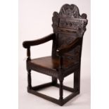 A 17th century Yorkshire area carved oak wainscot chair, width 62cm, depth 48cm, height 118cm