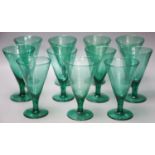 Eleven green wine glasses