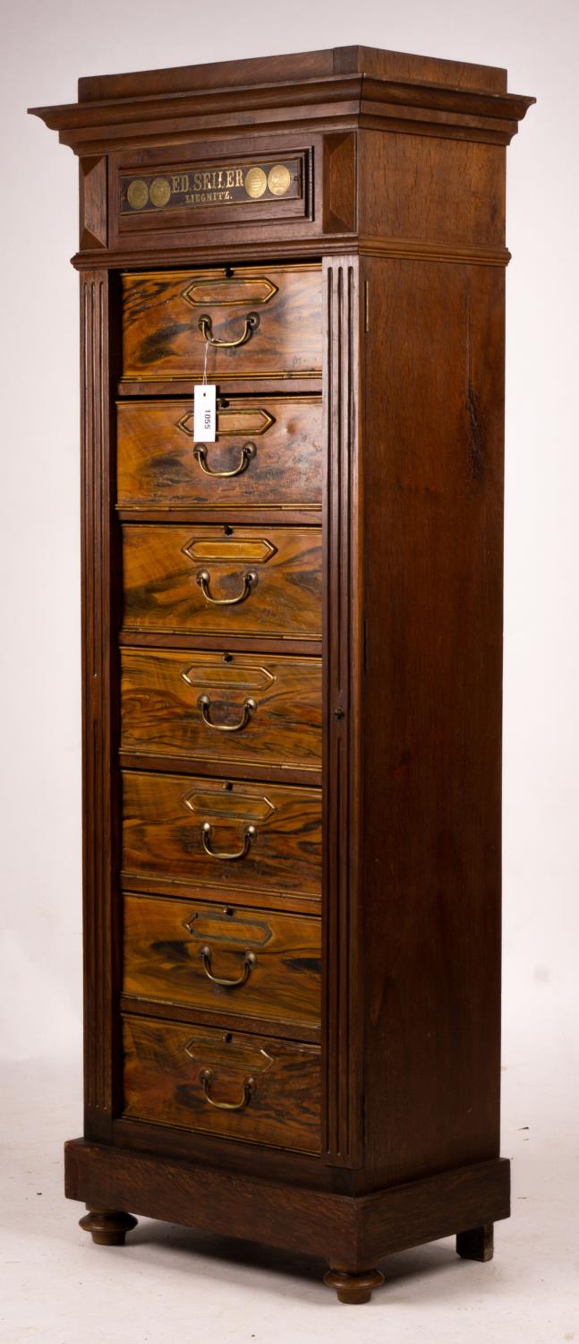A late 19th / early 20th century oak and simulated walnut shop storage chest / filing cabinet,