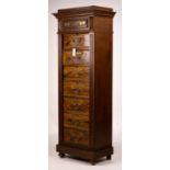 A late 19th / early 20th century oak and simulated walnut shop storage chest / filing cabinet,
