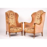 A pair of Edwardian satinwood banded mahogany wing armchairs, width 56cm, depth 75cm, height 110cm