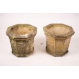 A pair of octagonal reconstituted stone garden planters, width 48cm, height 42cm