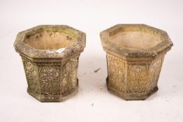 A pair of octagonal reconstituted stone garden planters, width 48cm, height 42cm