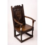 An 18th century style carved oak wainscot chair, width 56cm, depth 60cm, height 101cm