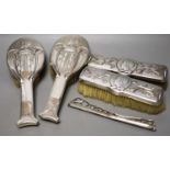 An Edwardian Art Nouveau silver mounted brush and comb set (a.f.), by William Hutton & Sons, London,