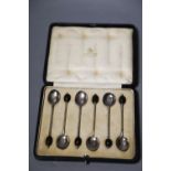A cased set of six George V silver bean end coffee spoons