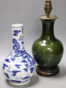 A Chinese blue and white dragon vase vase and Chinese green monochrome vase, mounted as a lamp27cm