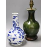 A Chinese blue and white dragon vase vase and Chinese green monochrome vase, mounted as a lamp27cm