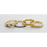 A 22ct gold wedding band, 4.8 grams, two 18ct gold rings including split pearl and diamond, gross