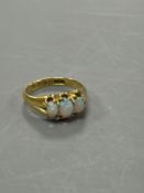 A late Victorian 18ct gold and claw set three stone white opal ring, size M, gross weight 4.1