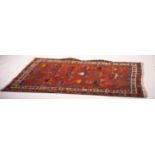 A Turkish red ground rug, 190 x 152cm