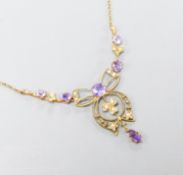 An Edwardian 9ct, amethyst and seed pearl set drop pendant necklace, 44cm,gross weight 4.3 grams.